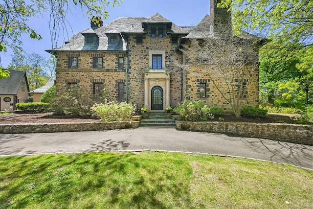 6 Prospect Ct, Hamden, CT 06517 - view of front facade with a high end roof, a chimney, and brick siding