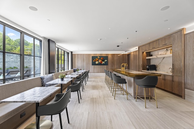 41 Richmondville Ave Unit 109, Westport, CT 06880 - bar with wooden walls, light wood-style flooring, and a sink