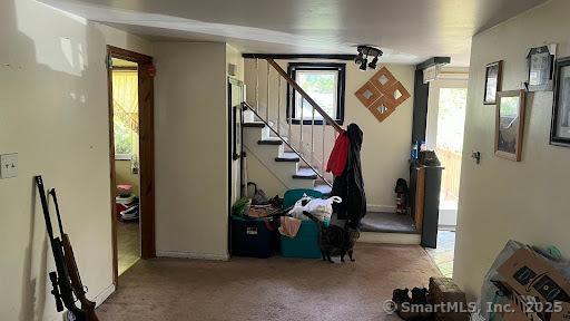 interior space with stairway and carpet floors