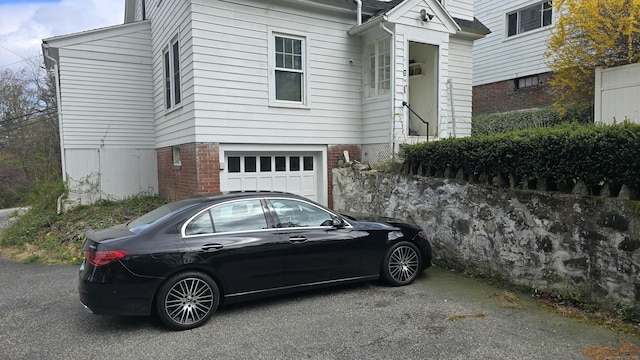 view of front of home featuring an attached garage and driveway