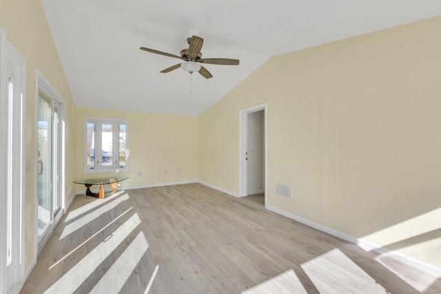 unfurnished living room featuring ceiling fan, lofted ceiling, and light hardwood / wood-style flooring