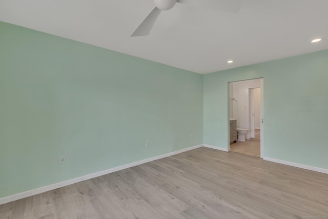 unfurnished room featuring ceiling fan and light wood-type flooring