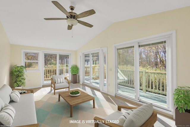 sunroom / solarium with ceiling fan and lofted ceiling