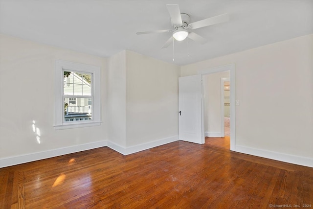 empty room with wood-type flooring and ceiling fan