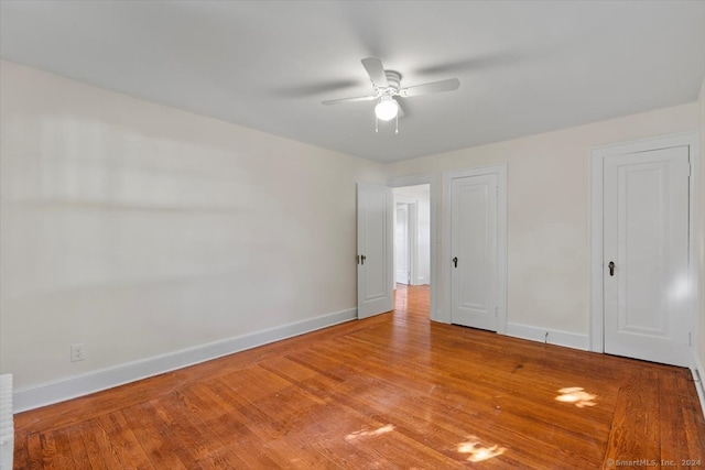 unfurnished room with light hardwood / wood-style floors and ceiling fan