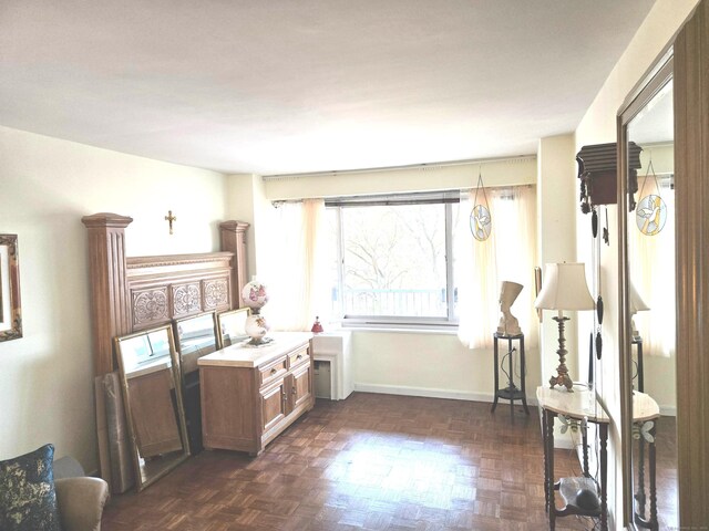 interior space featuring dark parquet flooring