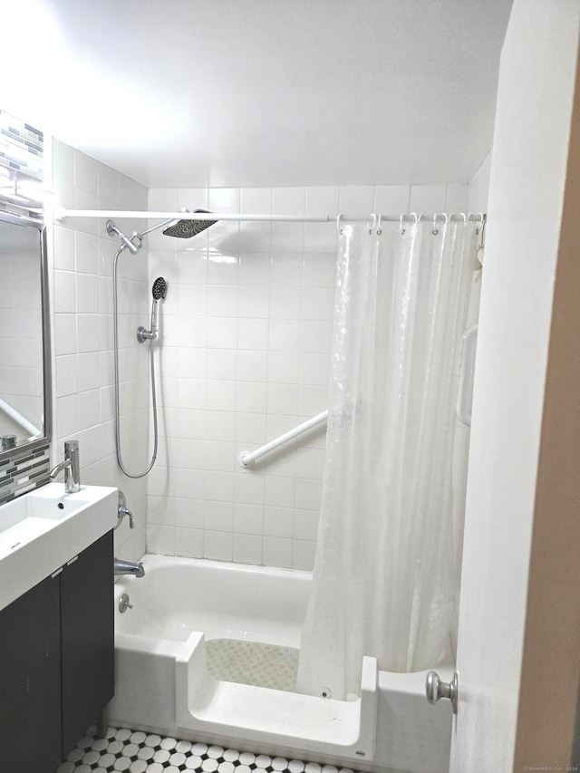 bathroom with tile patterned flooring, vanity, and shower / bath combo with shower curtain