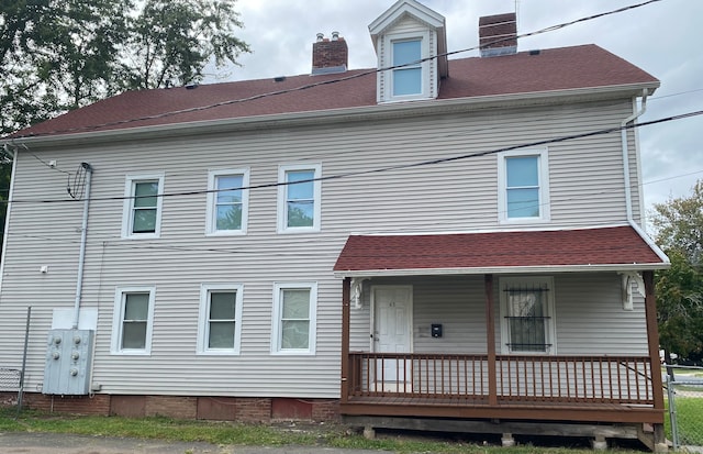 rear view of house with covered porch