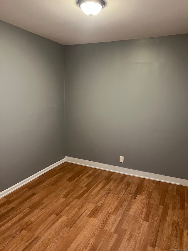 unfurnished room with light hardwood / wood-style flooring