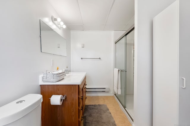 bathroom featuring a baseboard radiator, walk in shower, toilet, vanity, and tile patterned floors