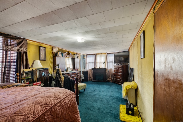 bedroom featuring carpet floors and wooden walls