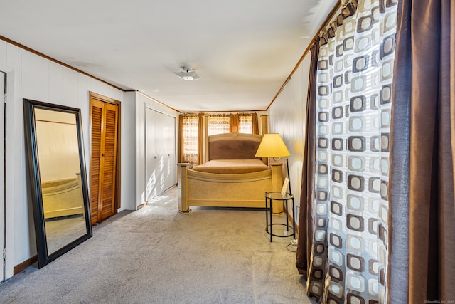 unfurnished bedroom featuring ornamental molding and light colored carpet