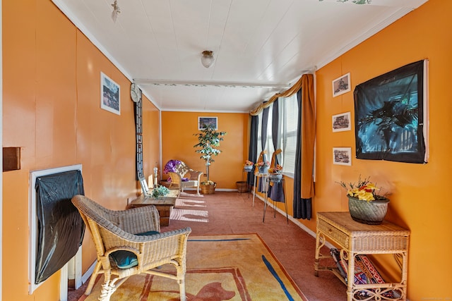 sitting room with light carpet and ornamental molding