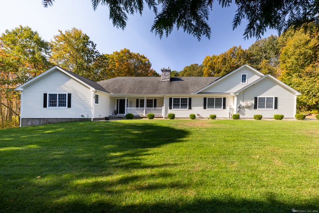 view of front of home featuring a front yard and a porch