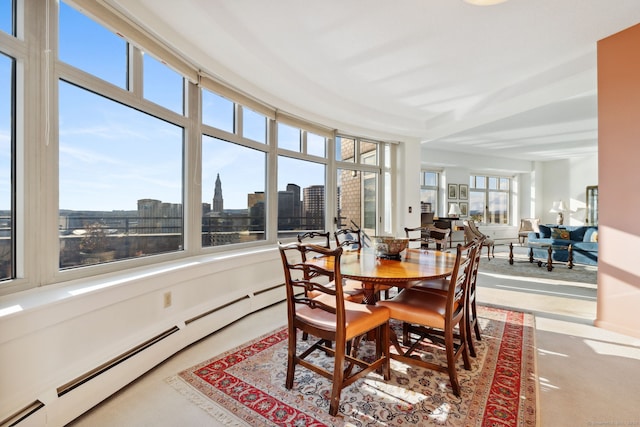 sunroom with a baseboard heating unit