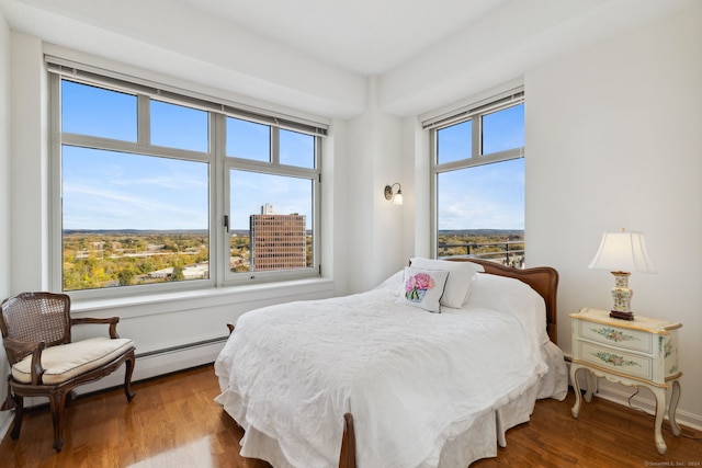 bedroom with hardwood / wood-style floors