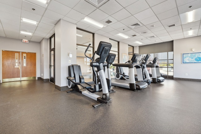 gym featuring a drop ceiling