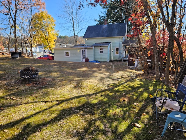 view of yard with an outdoor fire pit