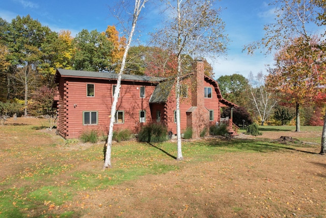 view of property exterior featuring a lawn