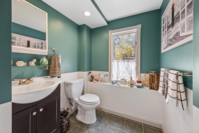 bathroom featuring vanity and toilet