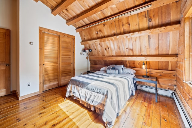 bedroom featuring vaulted ceiling with beams, light wood-type flooring, baseboard heating, wood ceiling, and a closet