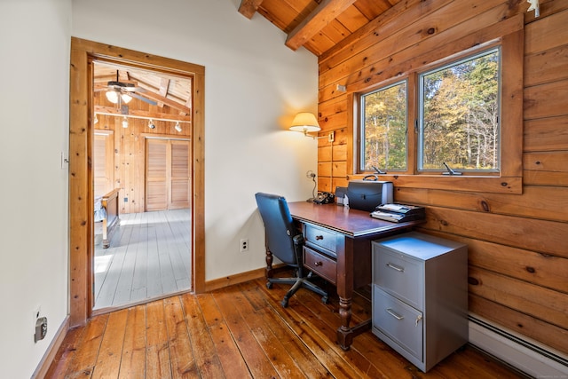 office area with wood ceiling, wood-type flooring, a baseboard radiator, vaulted ceiling with beams, and wood walls