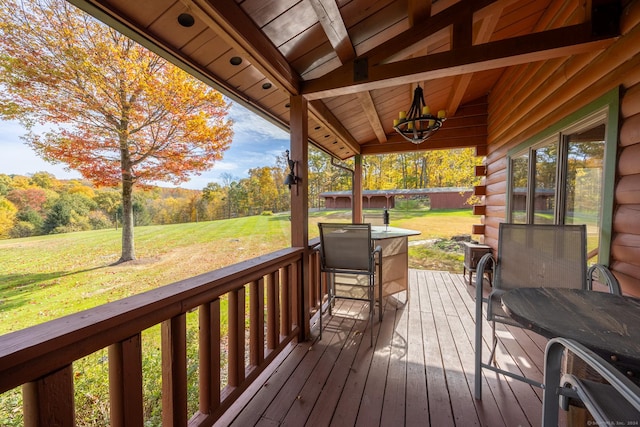 wooden deck with a yard