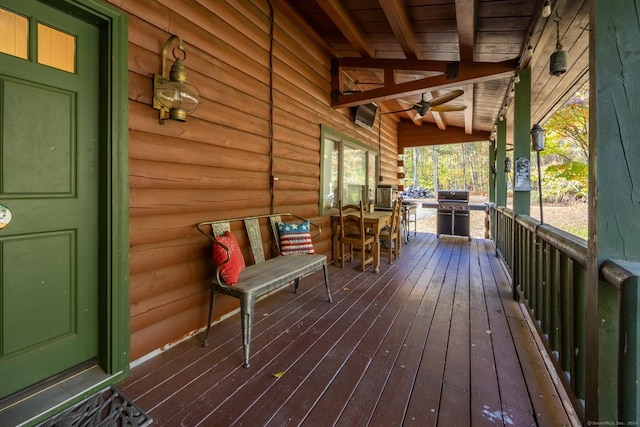 wooden deck with a porch, area for grilling, and ceiling fan