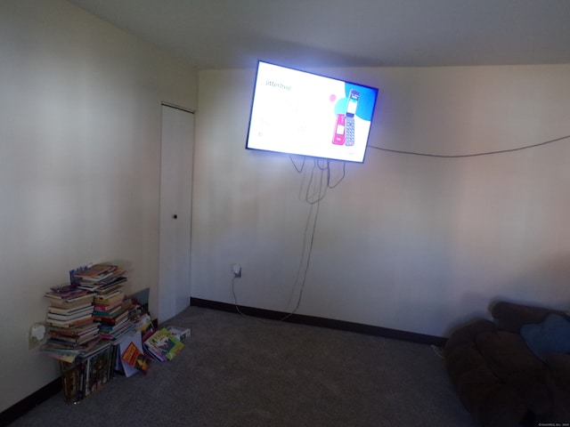 basement with dark colored carpet