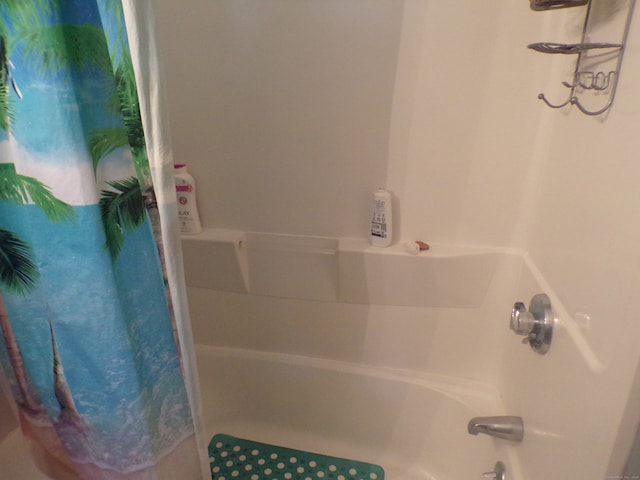 bathroom featuring shower / tub combo with curtain