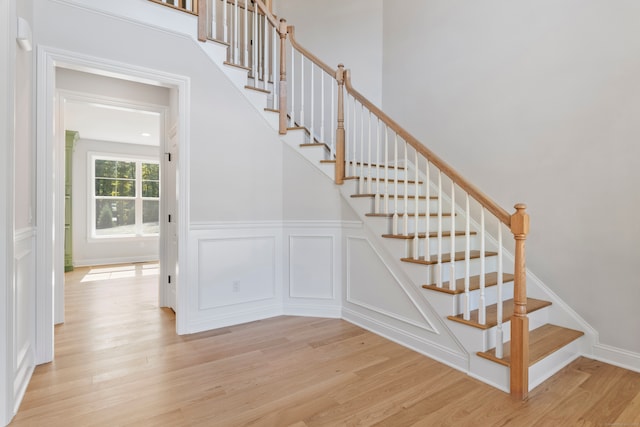 stairs featuring wood-type flooring