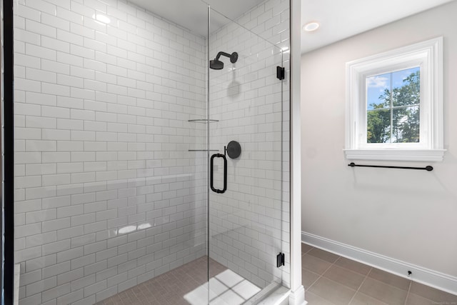 bathroom featuring tile patterned floors and an enclosed shower