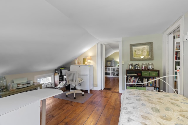 office space with vaulted ceiling and hardwood / wood-style flooring