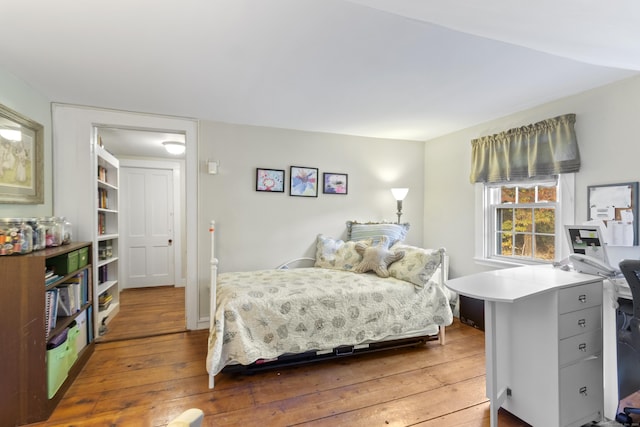 bedroom with wood-type flooring