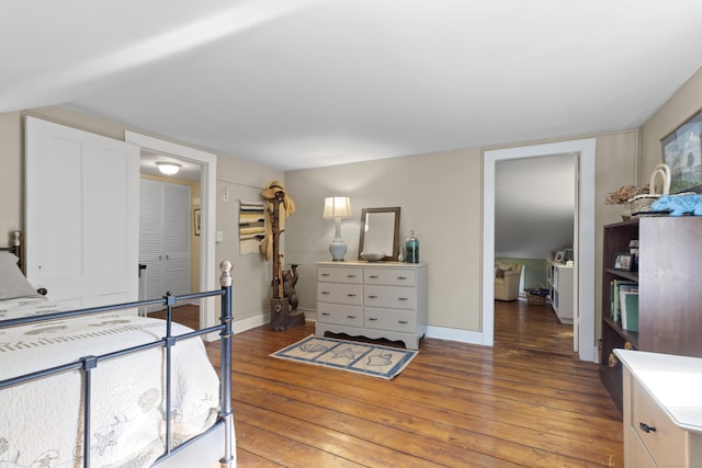 bedroom with hardwood / wood-style flooring and a closet