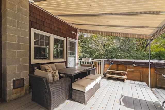 wooden terrace featuring a hot tub