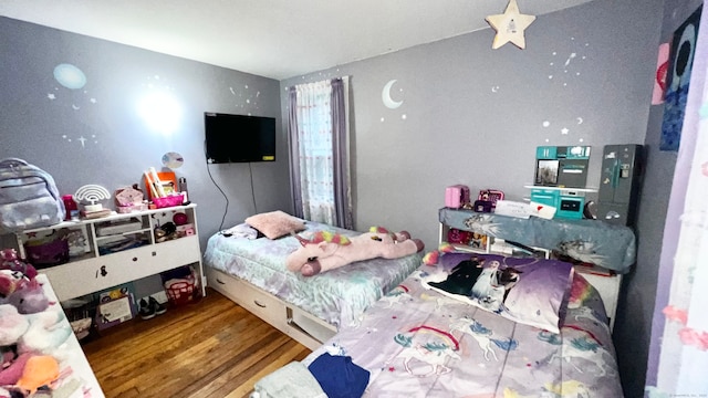 bedroom featuring hardwood / wood-style flooring