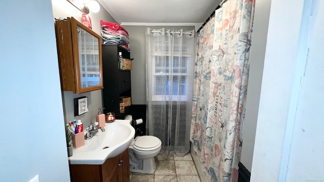 bathroom with curtained shower, toilet, tile patterned floors, vanity, and ornamental molding