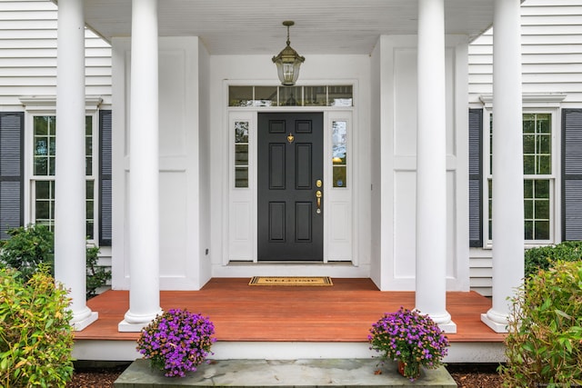 doorway to property with covered porch