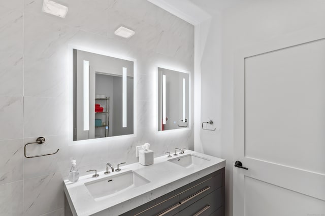 bathroom with tile walls and vanity