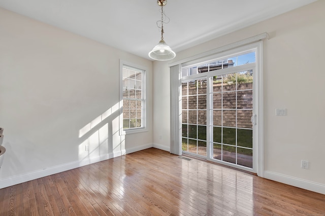 spare room featuring hardwood / wood-style flooring