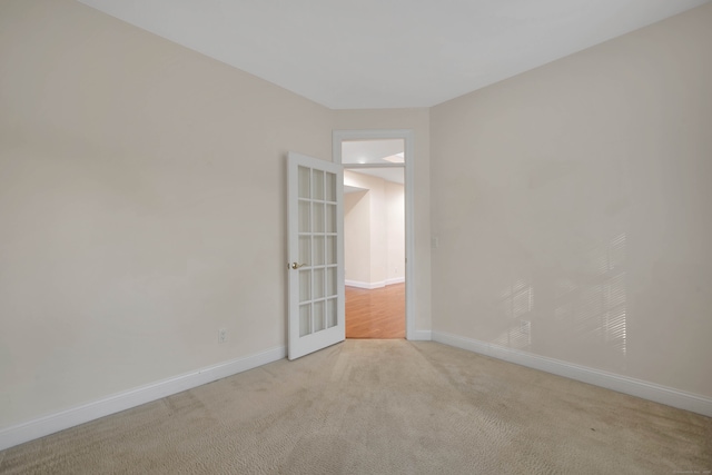 empty room featuring light carpet