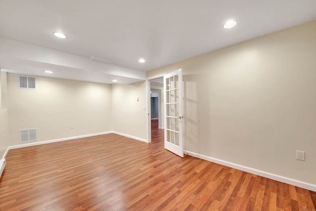 empty room with light hardwood / wood-style floors