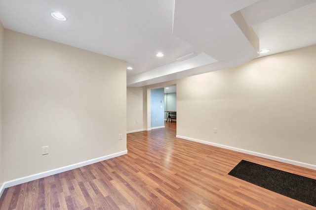 unfurnished room with wood-type flooring