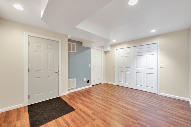 unfurnished bedroom featuring hardwood / wood-style flooring