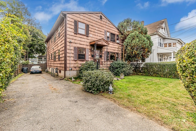 front of property with a front yard