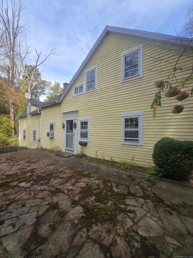 rear view of property featuring a patio