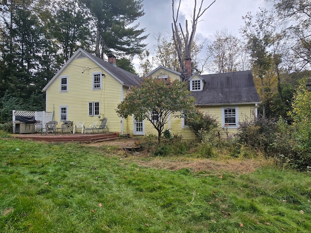 rear view of property with a deck