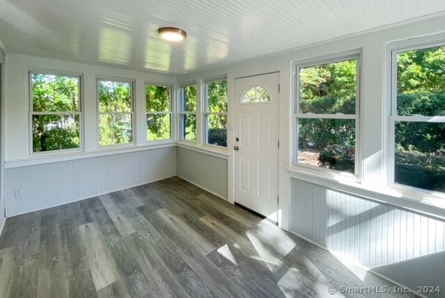 unfurnished sunroom featuring a healthy amount of sunlight