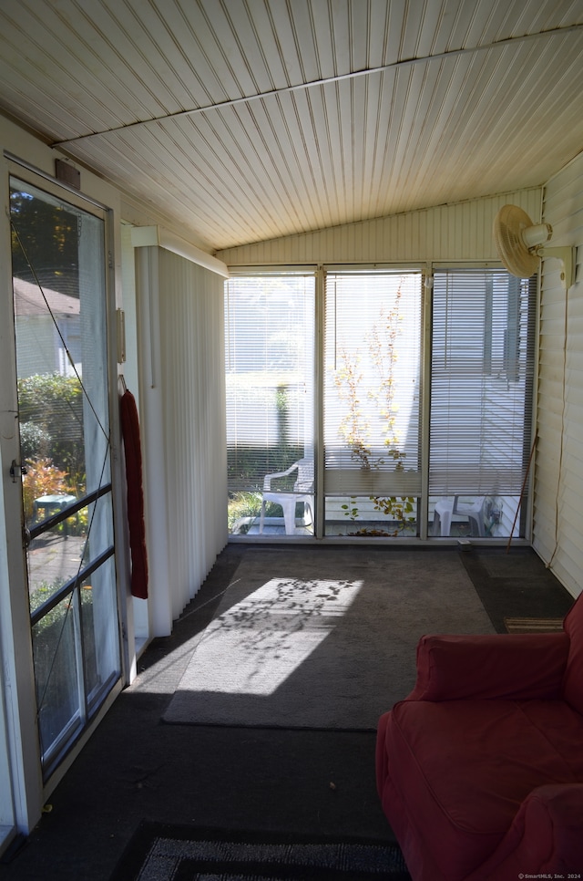 sunroom / solarium with vaulted ceiling